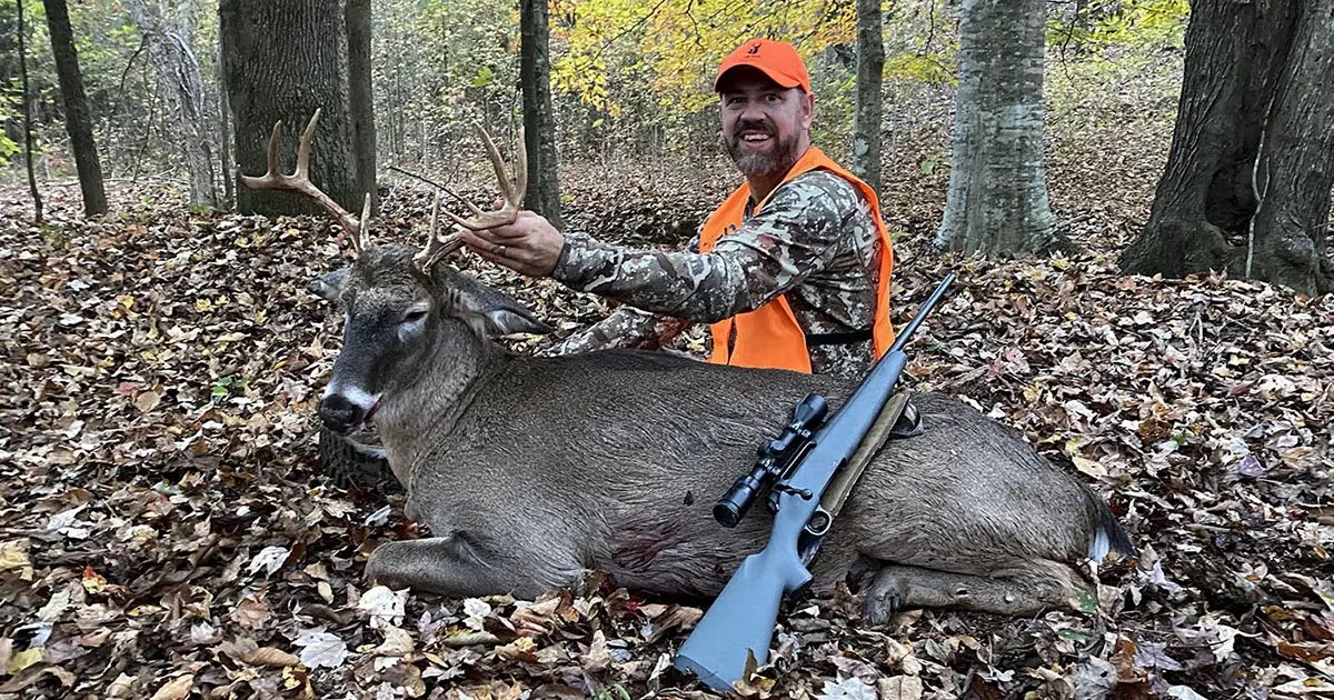 Photo of the author with a buck he harvest on his own property.
