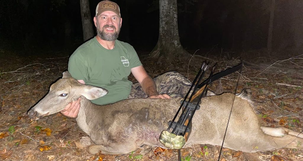 The author with a mature doe he harvested in 2020 with his Samick Sage.
