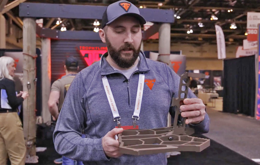 Trophyline employee holding the new HyperLite platform.